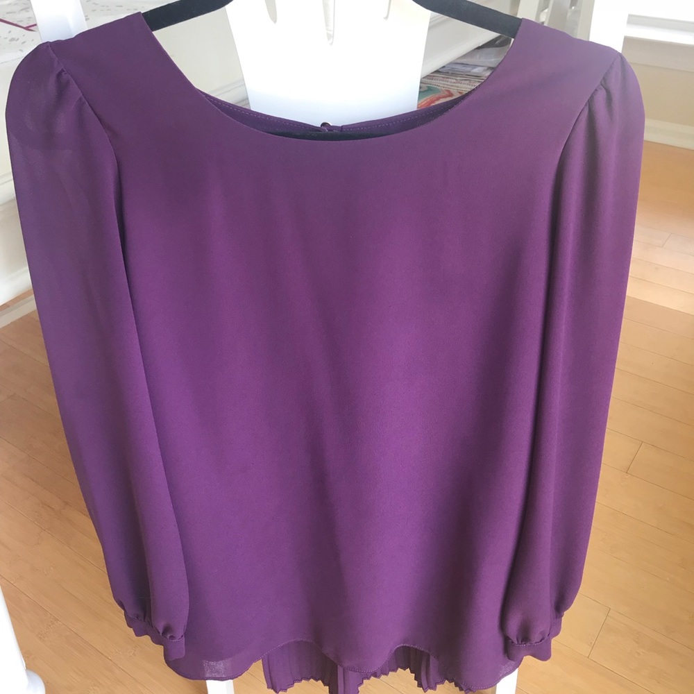 Purple top with detailed background